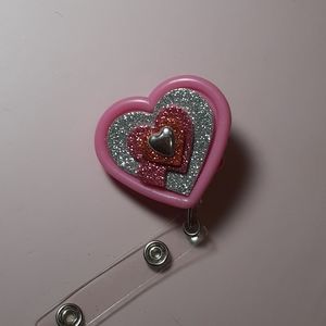 Retractable name badge holder